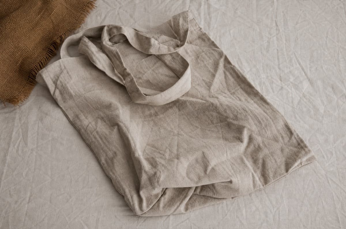 A linen shopper after one fold. Creasing is the fibre behaving normally.