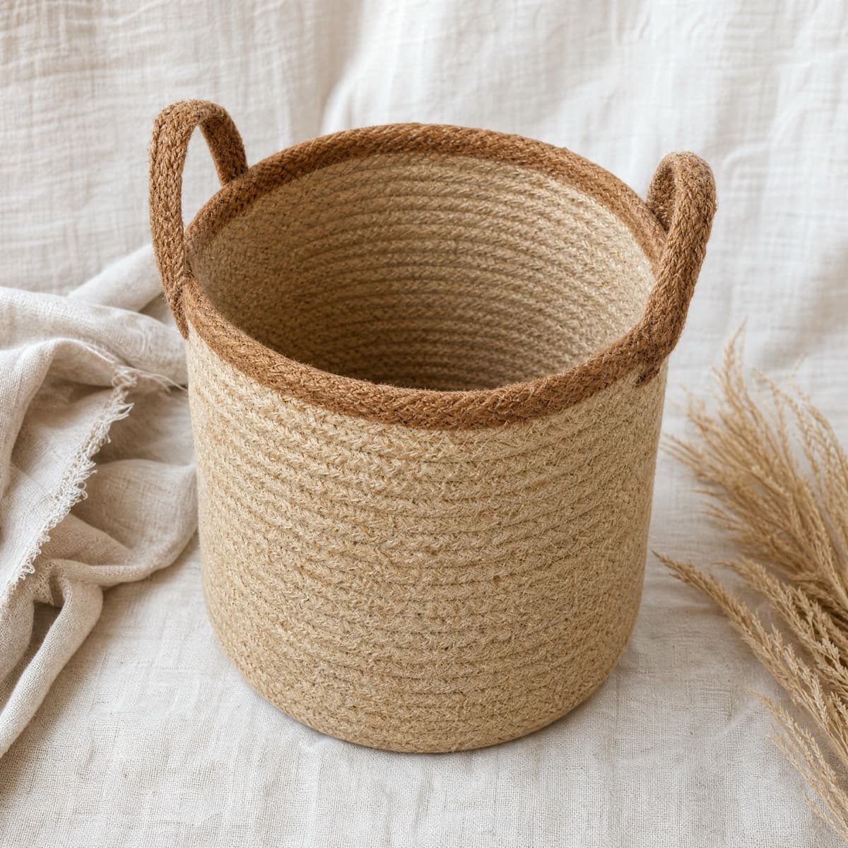 A round jute basket standing open