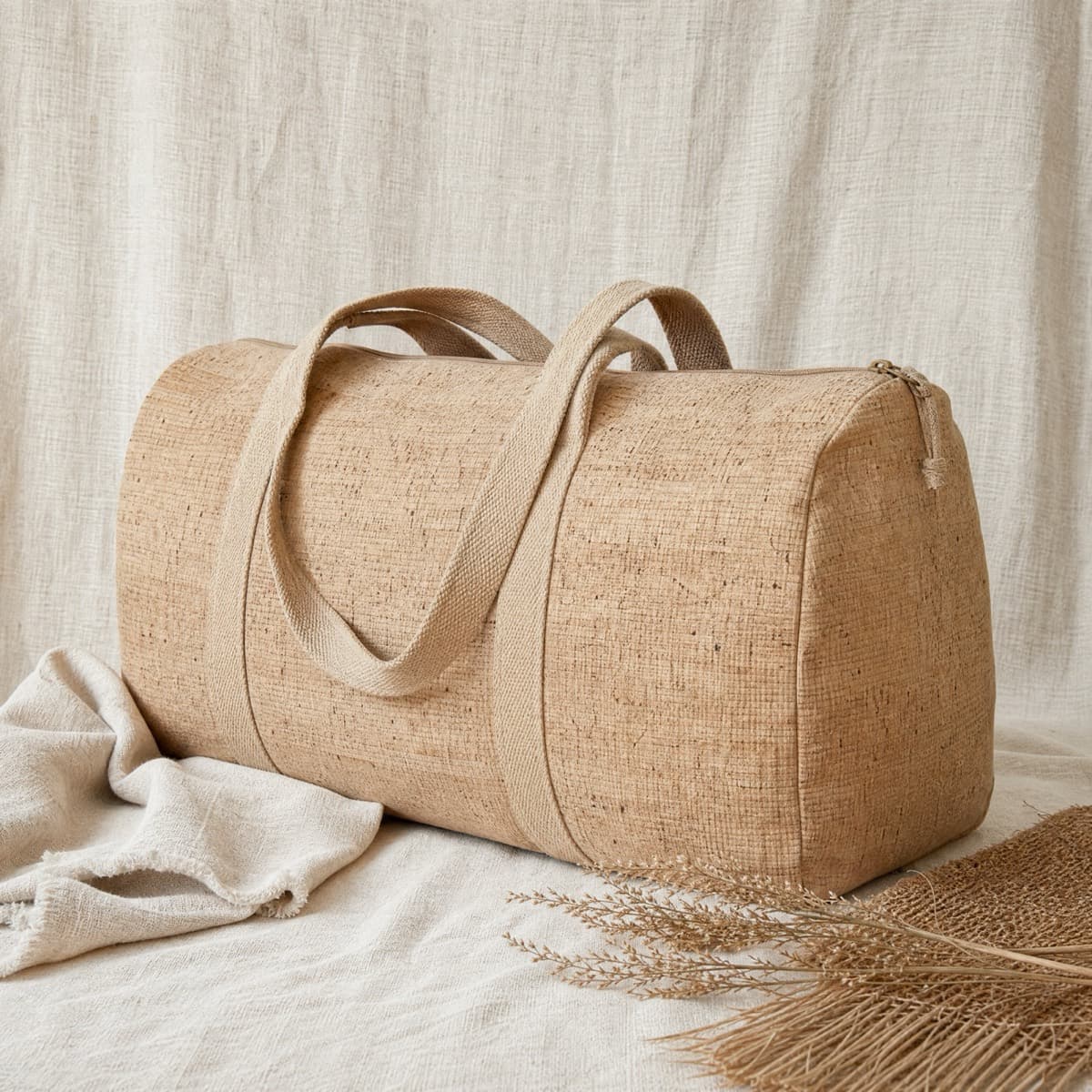 A large cork fabric weekender bag with twin handles
