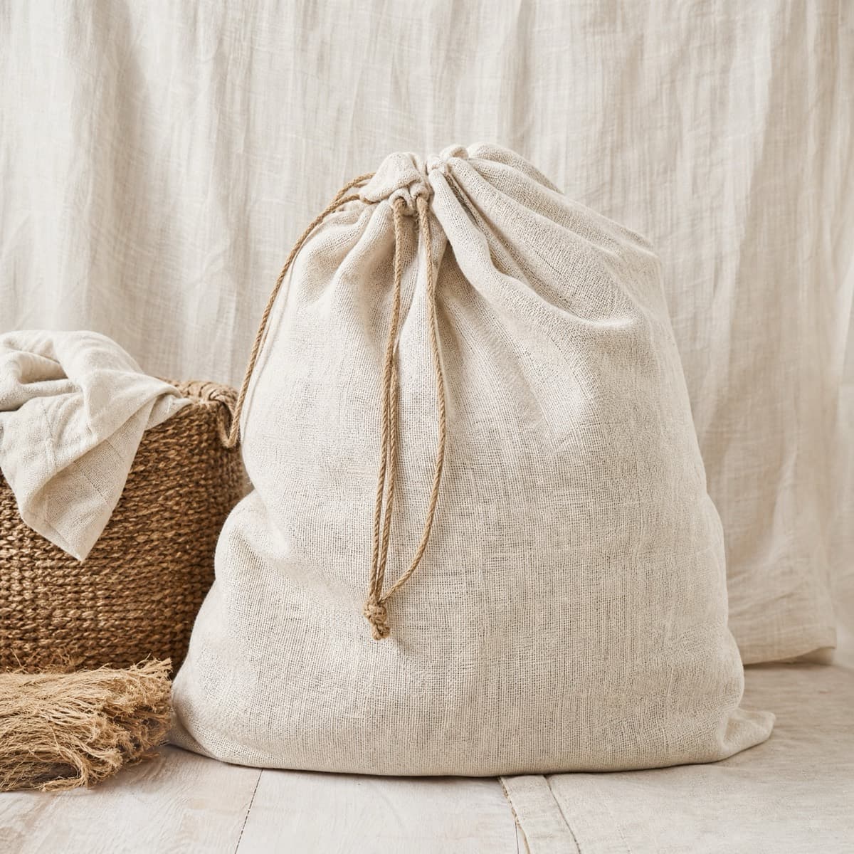 A large linen drawstring laundry sack