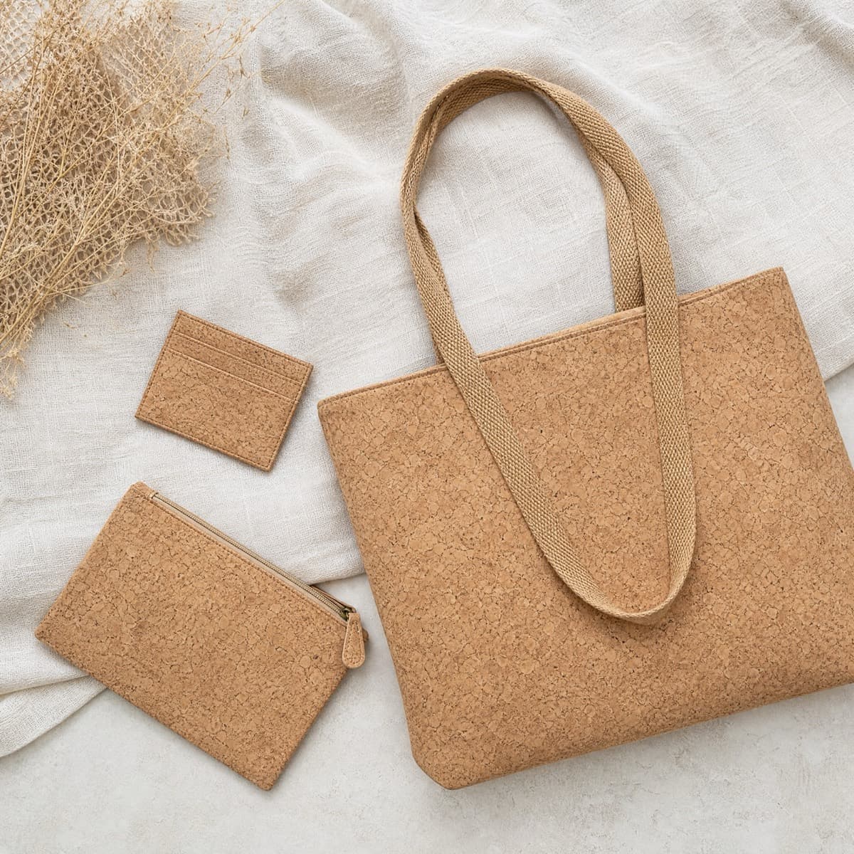 A cork tote, a cork card case and a cork pouch together